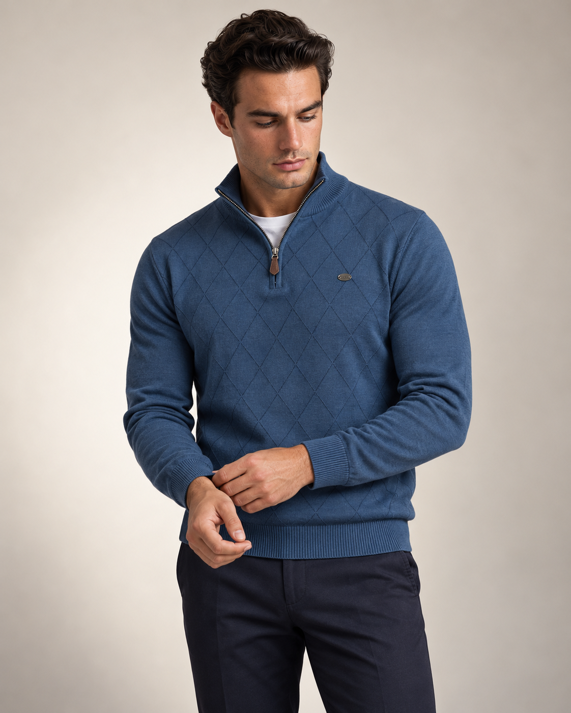 Man wearing the Winslow Argyle Quarter Zip in blue