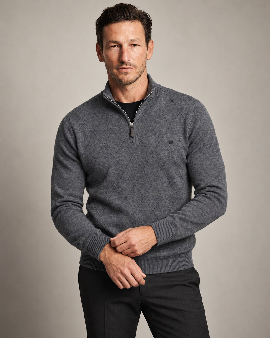 Man wearing the Winslow Argyle Quarter Zip in dark grey
