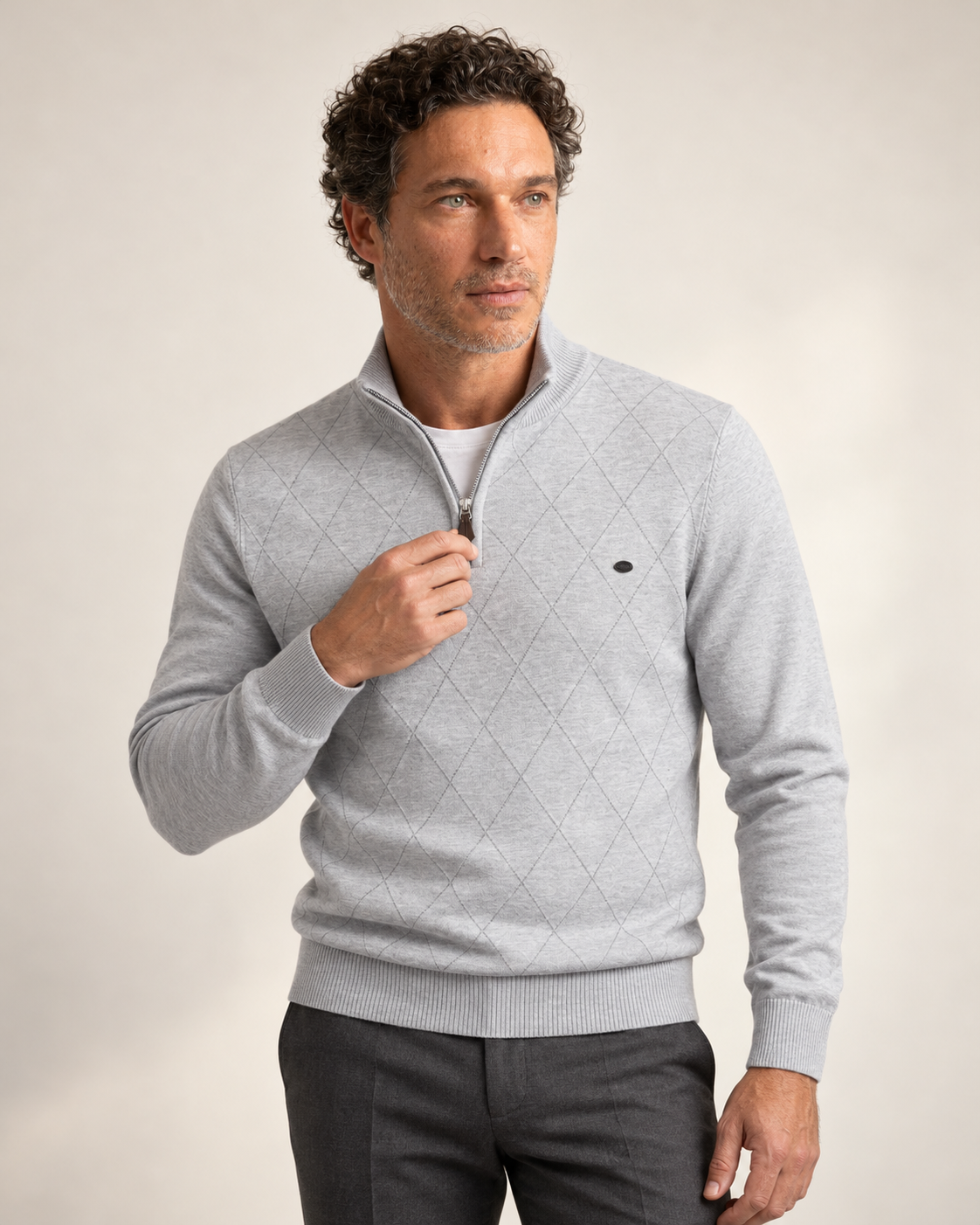 Man wearing the Winslow Argyle Quarter Zip in light grey