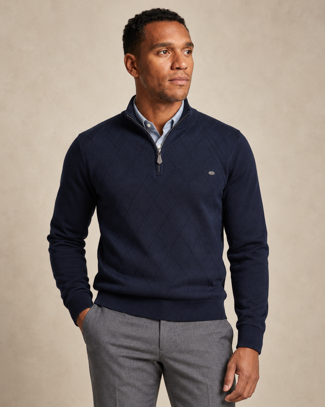 Man wearing the Winslow Argyle Quarter Zip in navy